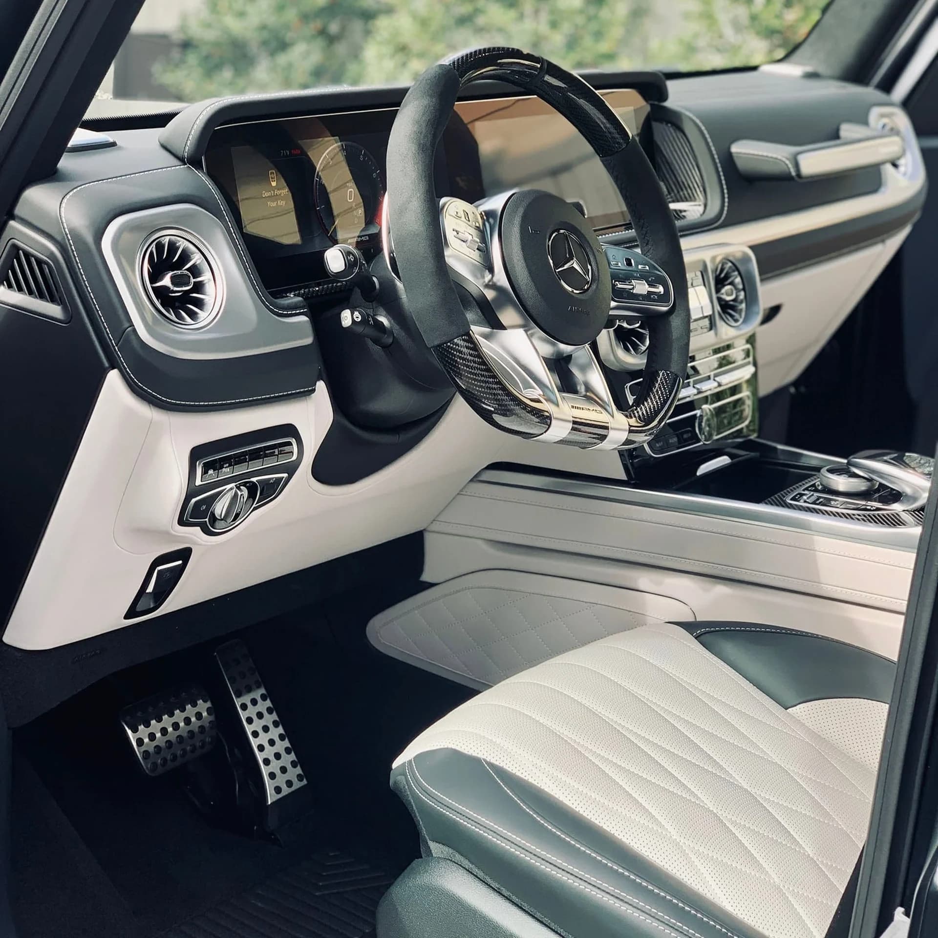 Clean Mercedes cabin with white leather seats